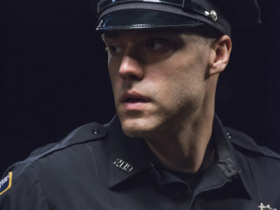 Bedlam Theatre actor in a scene: close up of a police officer in uniform